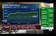 Dow jumps 440 points to record, rebounding from one-day slide